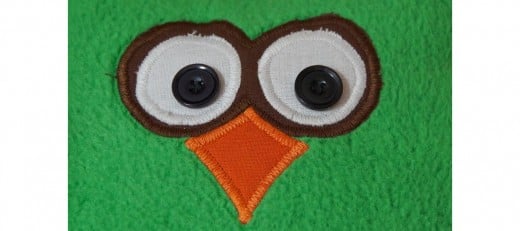 Appliqué owl face cushion