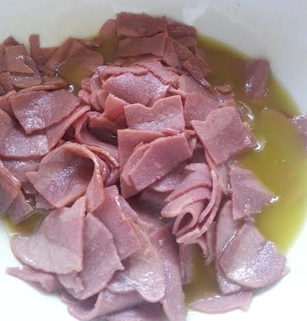 Turkey bacon fried in olive oil and ready to go