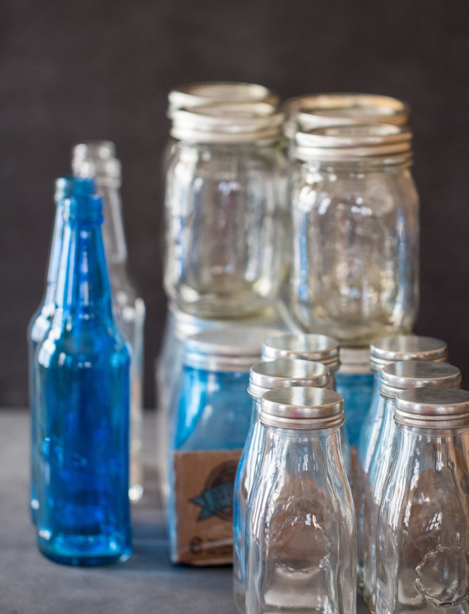 The glassware that I collected for my flower vases including clear and blue mason jars.