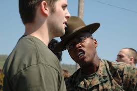 A drill instructor yells at a Marine recruit. Recruits get yelled-at most of the six-weeks they are in boot camp. I was yelled-at a lot when I was  kid. That's why I feared the Marines.