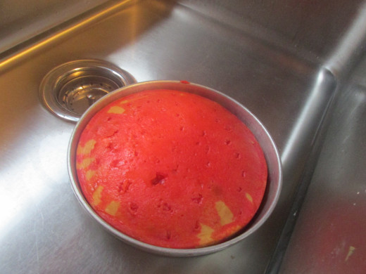 Dipping the cake in the pan in hot water to release jell-o from sides