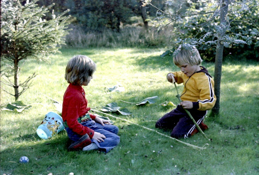 With a neighbor in the Ommen Woods, building weaponry. We had forts and arsenals, as one does.