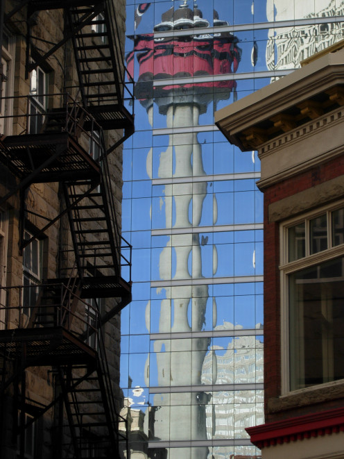 Calgary Tower, reflected in a near-by high rise.