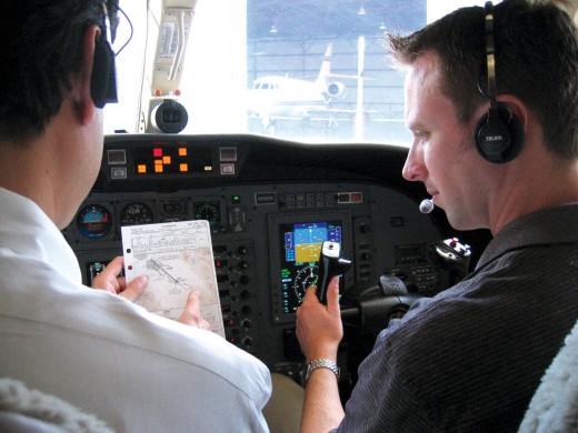 Checking flight weather and requesting control tower permission for the taxi-departure.