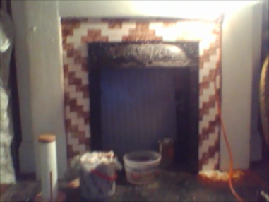 Paint stripped off face of fireplace.  Still working on hearth.