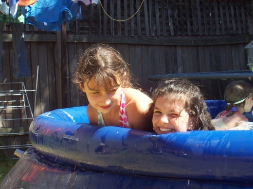Girls playing in a small pool