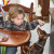He likes this little boy giving him food. He likes this little boy giving him food.