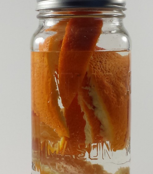 Vinegar and peels added to a clean jar