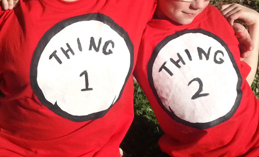 Older brothers add to the decorations with their homemade Thing 1 and Thing 2 shirts.