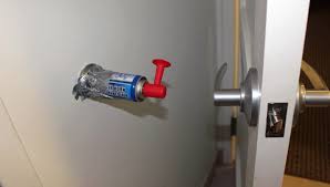 A canned horn placed behind  a door can give people a big laugh when the door is opened.