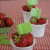 Strawberries in a cup used as place cards