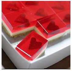 Strawberry jello with heart-shaped slice of strawberry. 
