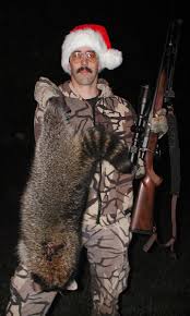 Coon hunter bags a big boar raccoon.