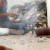 A boy winces at the smoke rising from the computer motherboards being melted over open fires in a recycling yard in Delhi. A boy winces at the smoke rising from the computer motherboards being melted over open fires in a recycling yard in Delhi.