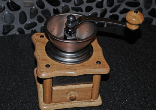 A manual burr grinder--whether manual or electric, burr grinders are preferred.