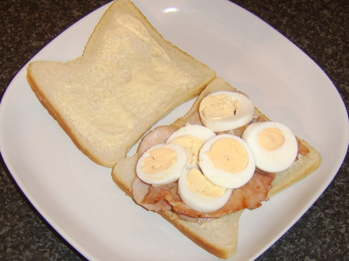 Egg slices are arranged on top of the bacon