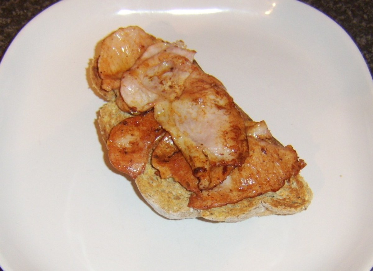 Bacon is laid on toasted bread