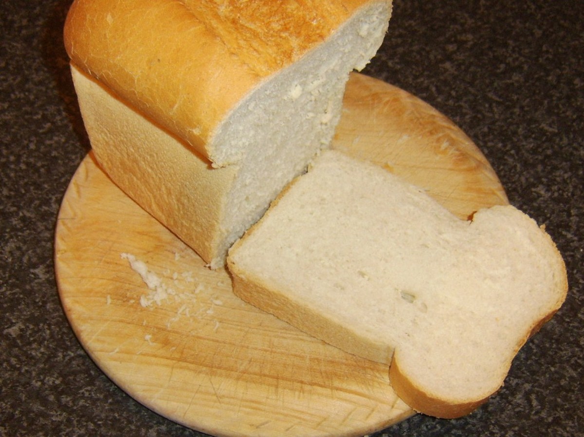 Thick slices are cut from a split tin loaf