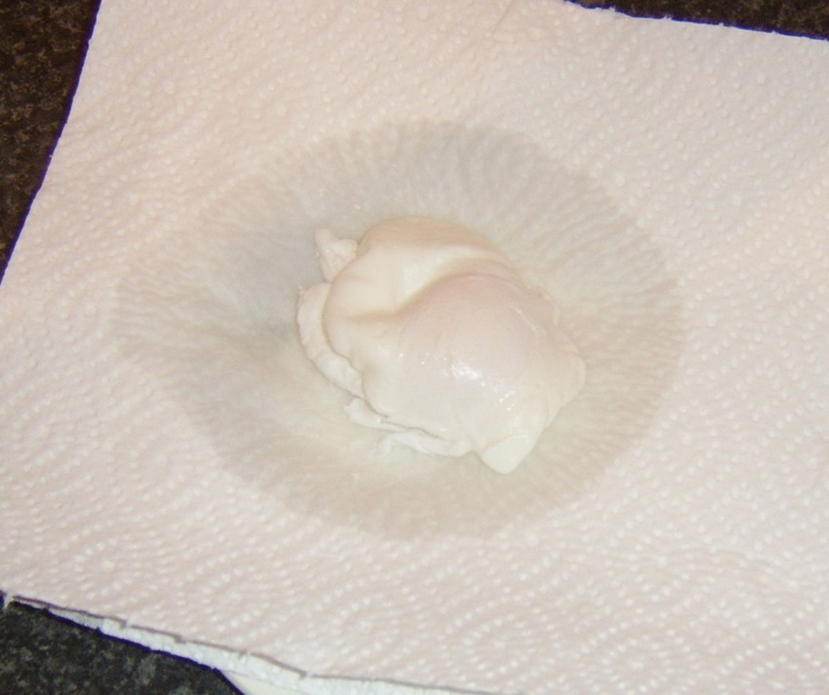 Poached egg is cooled and drained