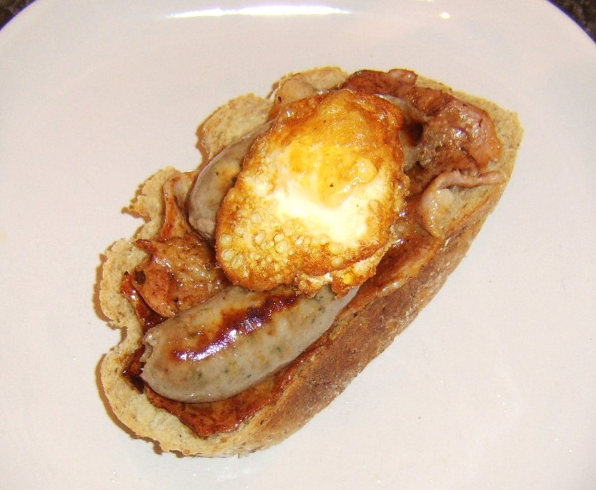 Twice cooked egg is sat on sausages and bacon