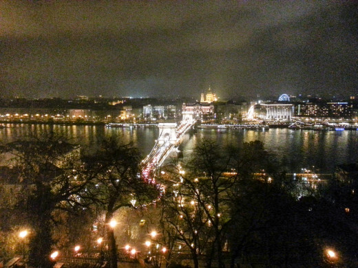 View of the Pest side from the Buda Castle, with the Chain Bridge in the foreground and St. Stephen's Basilica in the distance.