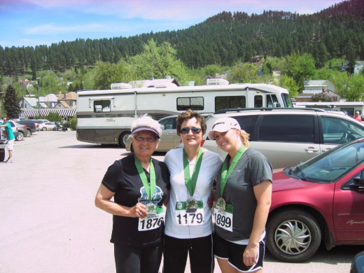 Jeanne, daughter Rene Brand, and granddaughter Kelsey Koch. Finish of Mickleson Trail Half Marathon in 2010. 