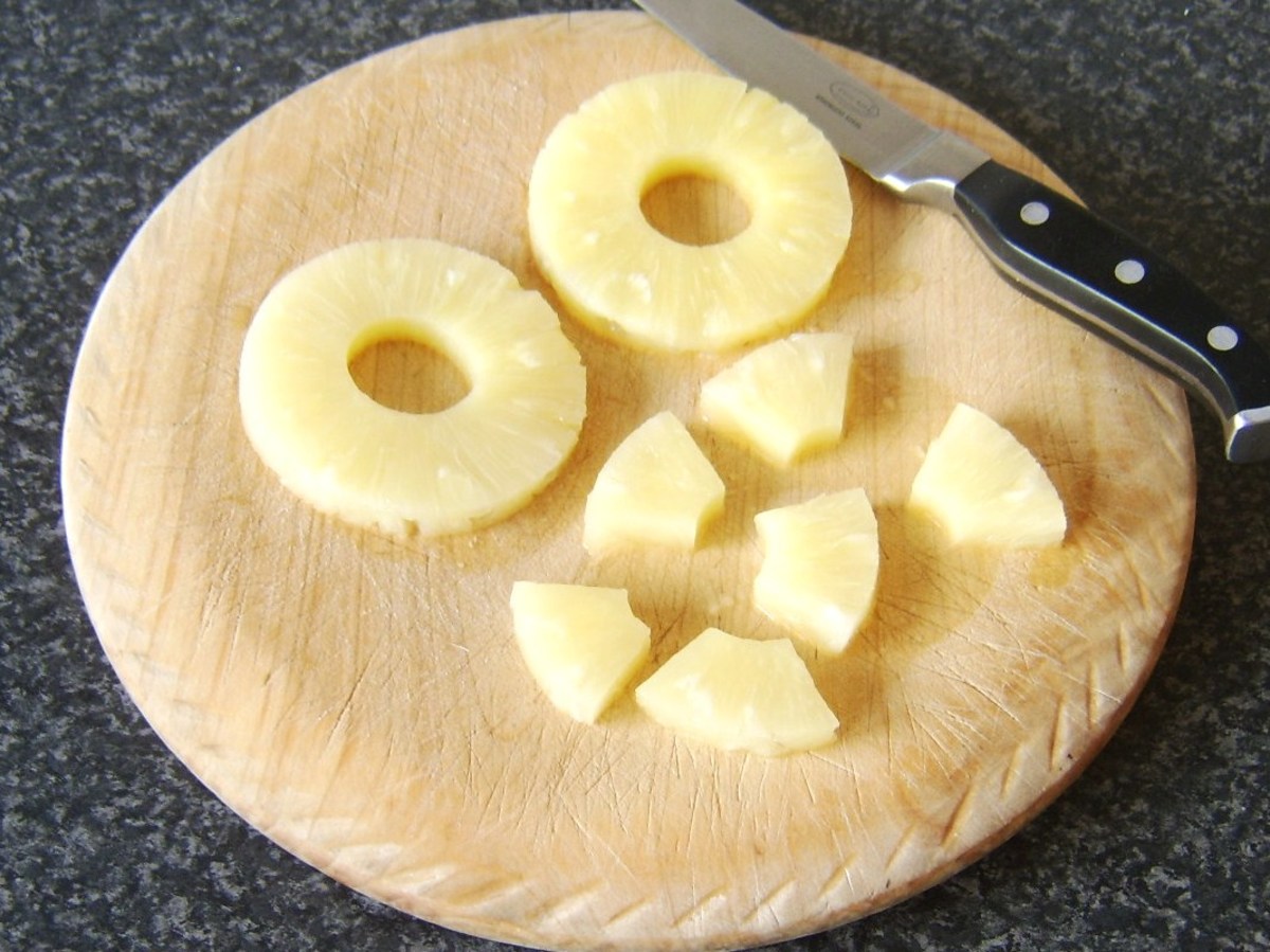 Pineapple rings are chopped in to chunks