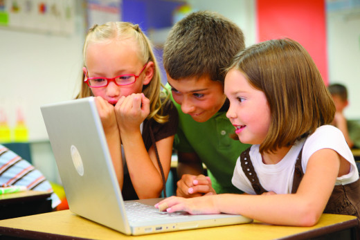 Children use computer at school.