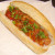 Mixed bell peppers and onion in sweet and sour sauce topped dog Mixed bell peppers and onion in sweet and sour sauce topped dog