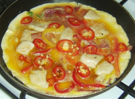 Chilli pepper slices are added to frittata