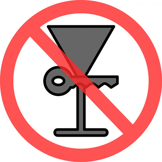 do not drink and drive clip art of a martini glass and keys and red slash over the two together