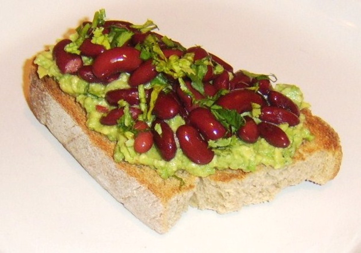 Mexican style beans on toast with guacamole and red kidney beans