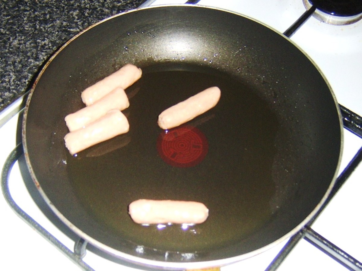Pan frying mini sausages