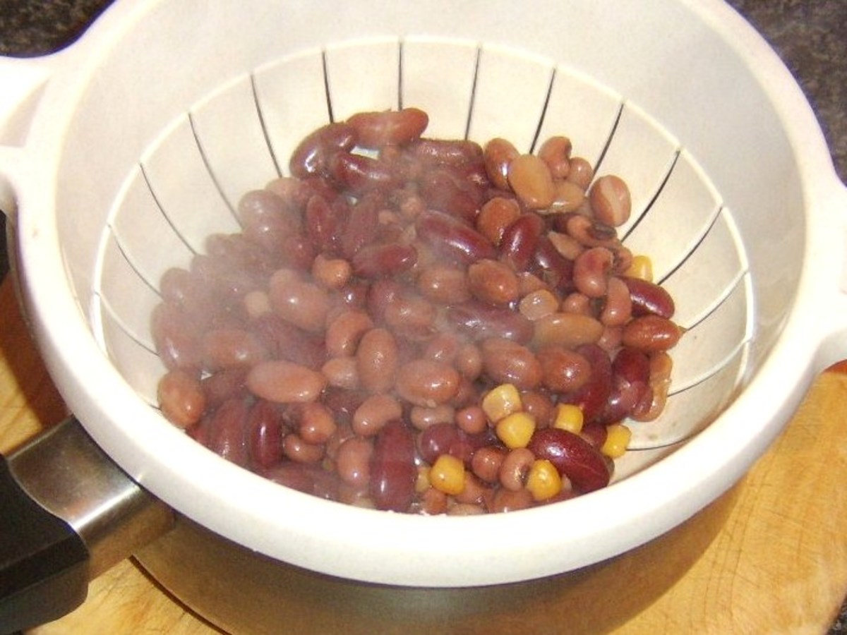 Draining heated five bean salad