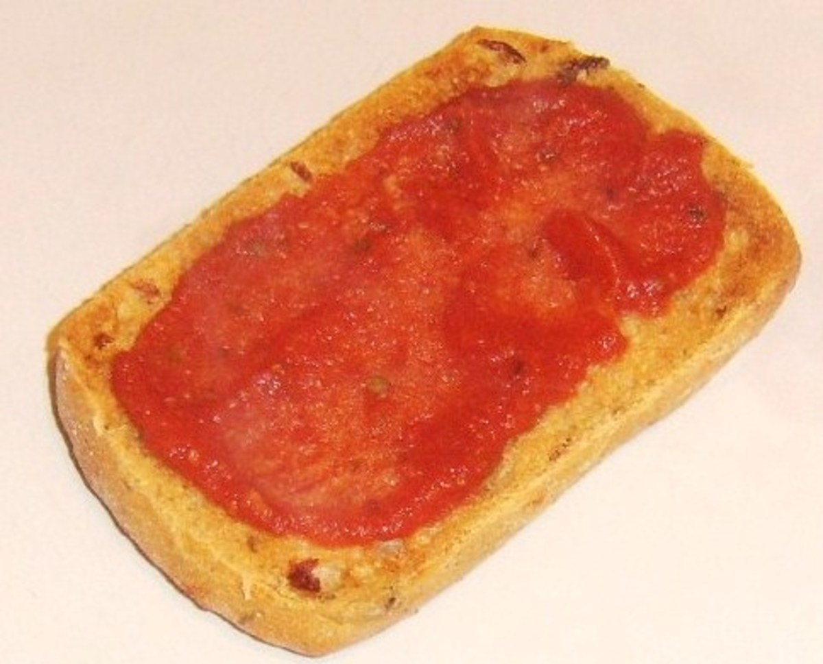 Tomato sauce spread on toasted ciabatta