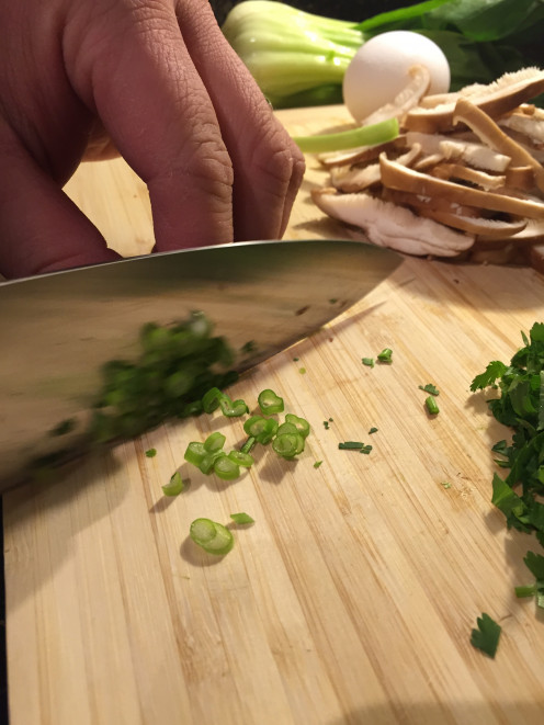Slice the green onions vertically. 