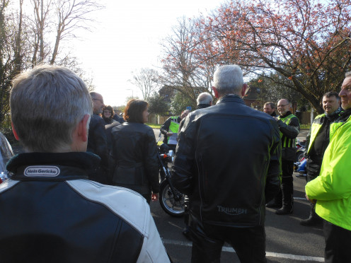 Everyone gathering around listening intently to Mike's plan for the day