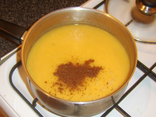 Ground cumin is added to blended soup