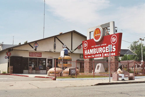 Newer unit on the site of the original McDonald's restaurant. San Bernardino, California. Part of the sign is still original. 