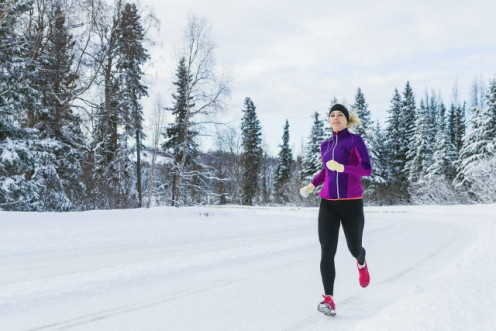 This girl shows a lot of personal- sacrifice to run in the cold and snow like she is doing.