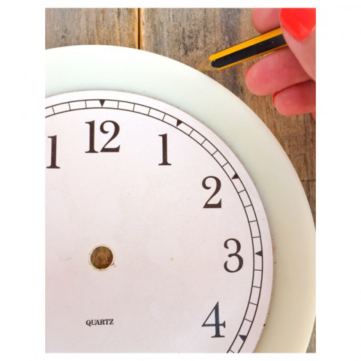 Mark the hours using an old clock template and pencil