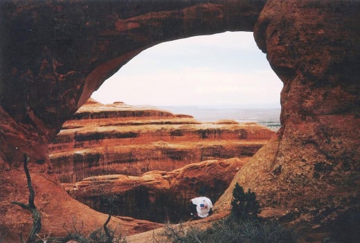 My buddy Scott sitting in an arch.