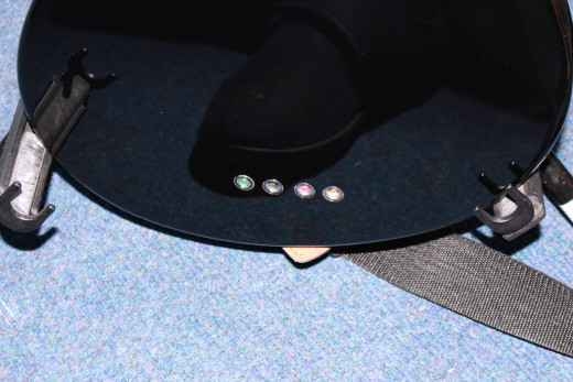 Rear view shows the holes to allow the strings to be threaded through the body