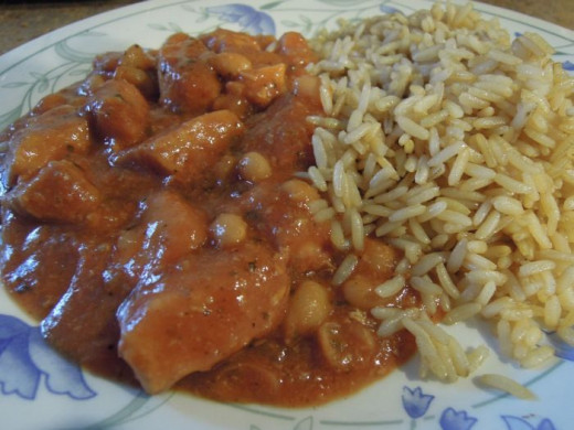 Finished Tuscan chicken and bean casserole served with rice.