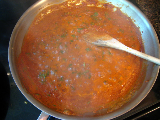 Preparing the masala before adding the tikka