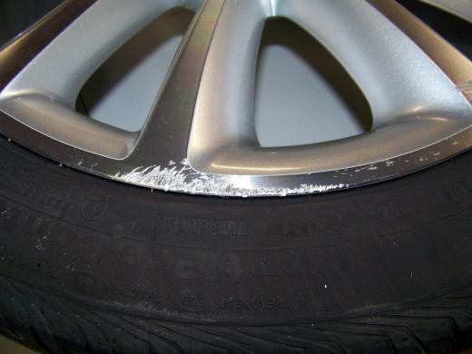 The "curbed" Buick Verano front wheel. What a mess!