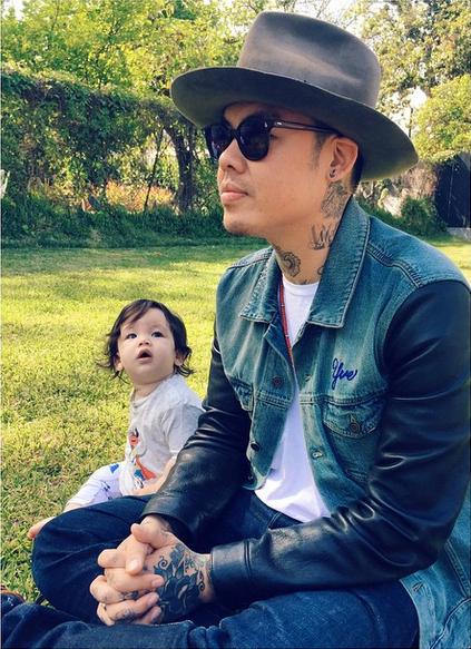Not the baby, but the one with a hat on.