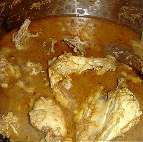 Marinated chicken added to the masala