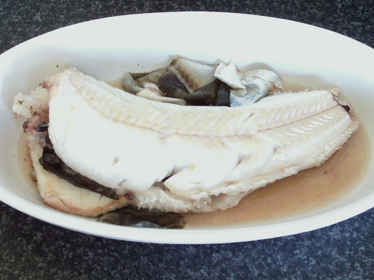 Skin is peeled from cooled poached codling