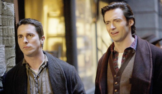 Christian Bale as Alfred Borden and Hugh Jackman as Robert Angier